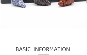 Close-up of three-piece set of natural stone Christmas tree ornaments in blue, black, and red