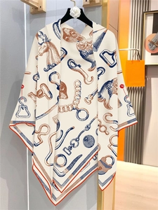 Detail view of 130cm square silk scarf featuring horse head and chain equestrian patterns
