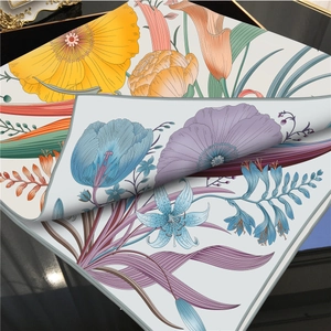 Floral silk-like square scarf with vibrant hand-painted patterns and grey stitched edges