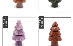 Macro detail of 2 and 3 inch handmade natural stone Christmas tree and mushroom figurines