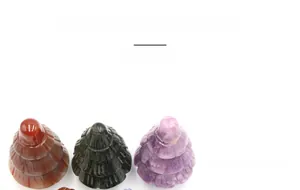 Macro detail of natural and synthetic stone Christmas tree statues with layered textures