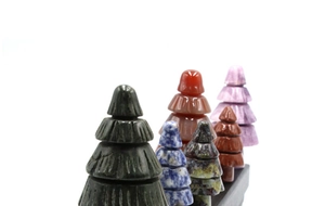Macro shot of assorted natural gemstone Christmas trees showing unique stone textures
