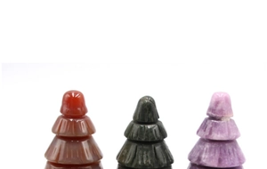 Detailed view of three-piece natural stone Christmas trees in various colors and textures