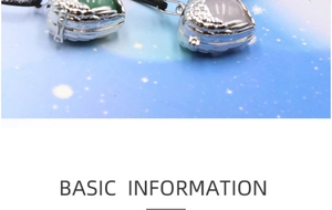 Detailed view of silver heart wing locket pendants with green and white gemstones