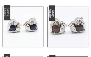 Close-up of angel wing lockets featuring lapis lazuli and grey agate gemstone orbs