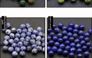 Macro detail of polished 10mm round blue spot jasper and lapis lazuli stone beads