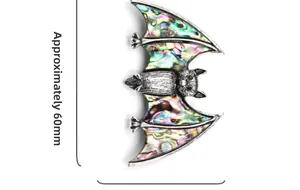Detail of bat brooch pendant with iridescent abalone shell inlay, measuring 60mm wide