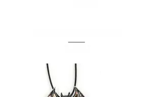 Detail view of gothic bat pendant with abalone shell inlay measuring approx 36mm