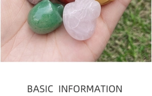 Close-up of assorted polished crystal gemstones held in hand for size comparison