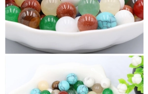Macro detail of mixed semi-precious stone spheres and natural gemstone beads in white bowl