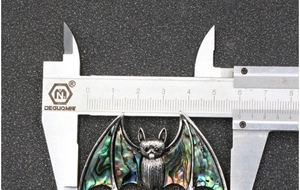 Detailed measurement of 55mm bat brooch with colorful abalone shell inlays