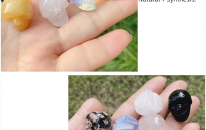 Close-up of assorted 1-inch carved crystal skulls in natural and synthetic gemstones