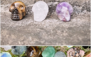Macro detail of various natural gemstone skull carvings and crystal mineral stones