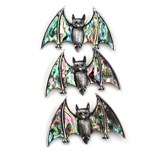 Three vintage silver bat necklaces with colorful inlaid natural abalone shell wings