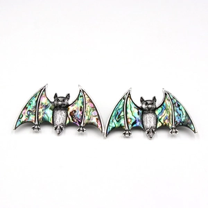 Silver bat pendant featuring iridescent abalone shell inlay with fine wing details
