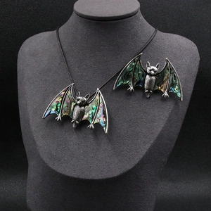 Gothic bat necklace and brooch set featuring colorful abalone shell in silver finish
