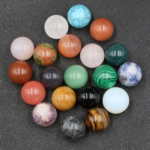 Variety of 20mm polished natural gemstone spheres showing diverse textures on dark background