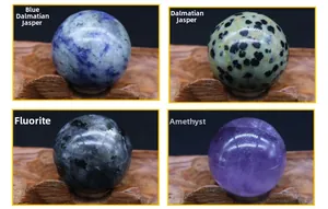 Detailed view of four gemstones like Amethyst and Labradorite on carved wooden stands