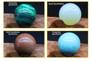Detailed view of 20mm crystal spheres in malachite, opal, goldstone and turquoise on wood stands