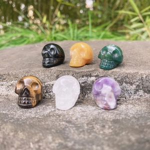 Set of six handcrafted 1-inch natural crystal skull carvings in various gemstones