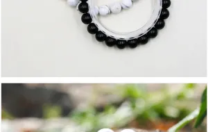 Macro view of 8mm black onyx and white turquoise beads with yin yang style