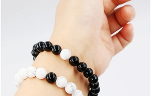 Detail of 8mm black agate and white turquoise bead bracelets for couples or friends