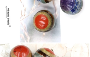 Detailed view of 20mm multilayered natural gemstone abacus beads with polished finish