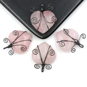 Set of four handmade heart-shaped natural rose quartz pendants with black wire wrap art