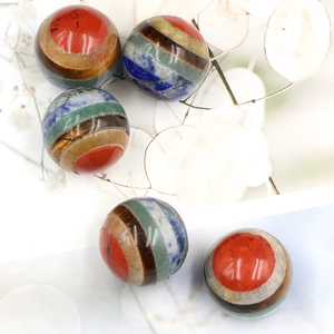 Set of five 20mm seven chakra healing crystal spheres made of natural layered gemstones