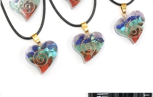Macro shot of heart-shaped crystal pendants with colorful stones and spiral copper wire