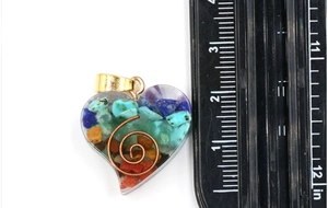 Macro view of heart resin pendant with natural crystals and copper coil spiral detail
