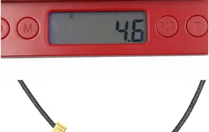 Detail showing natural crystal heart pendant weight being measured as 4.6g on a digital scale