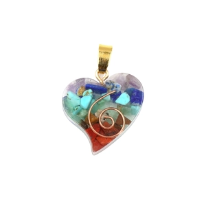 Chakra heart pendant with colorful natural crystal stones and copper spiral in resin