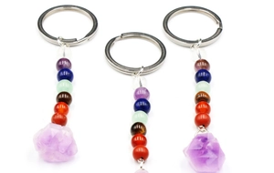 Detailed set of three chakra gemstone keychains with natural purple amethyst crystal raw stones