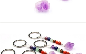 Detail of amethyst raw stone keychain with seven chakra beads and metal ring
