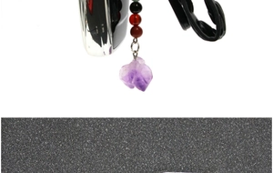 Close-up of natural amethyst stone keychain with colorful beads and leather strap