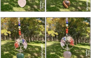Detail of tree of life pendants with natural healing crystals and heart stones