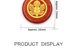 Macro view of a 25mm red round gemstone pendant featuring a gold tree of life design