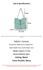 Detailed size chart and dimensions for the mint green canvas tote bag with logo