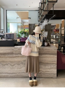Pink plush faux shearling mini tote bag styled with casual autumn winter outfit