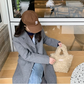 Chic beige faux shearling mini tote bag with stylish R-letter baseball cap and wool coat