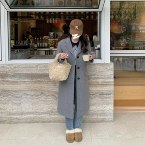 Chic beige fleece mini handbag for women styled in a trendy autumn street fashion outfit