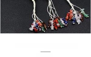 Detailed view of handmade woven hanging ornament featuring colorful natural tumbled stones