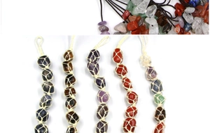 Detail view of colorful natural stone pendants with white woven nets and black cords
