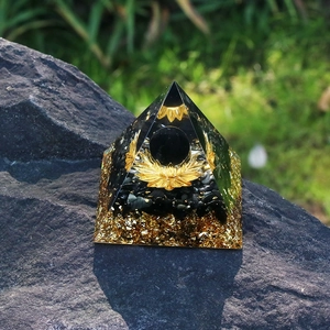 6cm Orgone crystal pyramid with black obsidian ball, lotus charm and gold foil