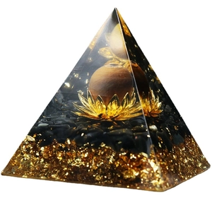 6cm Orgonite crystal pyramid with lotus, wooden sphere, and black stones in resin