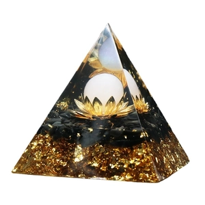 6cm Orgone crystal pyramid featuring gold foil, black gravel, and a lotus flower sphere