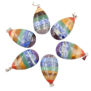Set of six multicolored teardrop chakra pendants made from layered natural crystals and stones