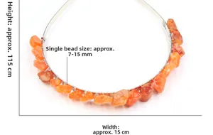 Detail of handmade crown featuring raw orange natural stones and fine wire wrapping