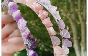 Detail of handcrafted wire-wrapped amethyst and rose quartz crystal headbands